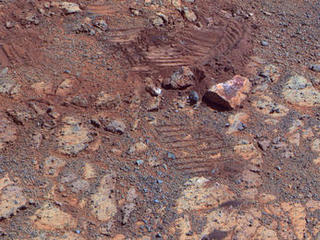 This image from the panoramic camera (Pancam) on NASA's Mars Exploration Rover Opportunity shows where a rock called "Pinnacle Island" had been before it appeared in front of the rover in early January 2014.