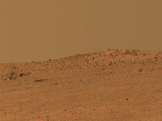 The boulder-studded ridge in this scene recorded by NASA's Mars Exploration Rover Opportunity is "McClure-Beverlin Escarpment," informally named for Jack Beverlin and Bill McClure, engineers who on Feb. 14, 1969, risked their lives to save NASA's second successful Mars mission, Mariner 6, on its launch pad.