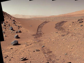 This look back at a dune that NASA's Curiosity Mars rover drove across was taken by the rover's Mast Camera (Mastcam) during the 538th Martian day, or sol, of Curiosity's work on Mars (Feb. 9, 2014).