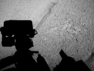 NASA's Curiosity Mars rover caught its own shadow in this image taken just after completing a drive of 329 feet (100.3 meters) on the 547th Martian day, or sol, of the rover's work on Mars (Feb. 18, 2014).