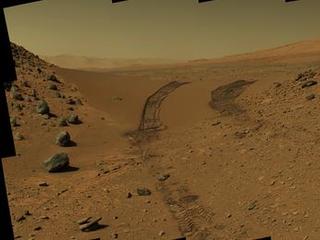 This look back at a dune that NASA's Curiosity Mars rover drove across was taken by the rover's Mast Camera (Mastcam) during the 538th Martian day, or sol, of Curiosity's work on Mars (Feb. 9, 2014).