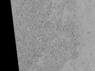 This image shows details of the lava covered plains near the equator of Mars. The darker looking area has a rough lava surface with all the shadows giving the region a darker appearance.