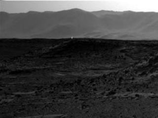This image from NASA's Curiosity Mars rover, taken on April 3, 2014, includes a bright spot near the upper left corner. Possible explanations include  a glint from a rock or a cosmic-ray hit.