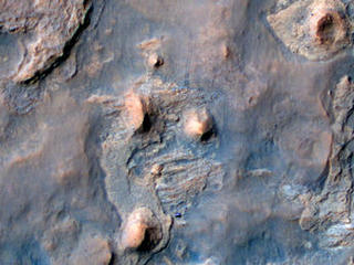NASA's Curiosity Mars rover and tracks from its driving are visible in this view from orbit, acquired on April 11, 2014, by the High Resolution Imaging Science Experiment (HiRISE) camera on NASA's Mars Reconnaissance Orbiter.