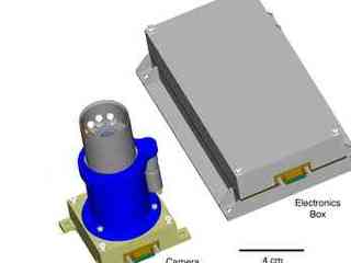 A small, upright cylindrical device about 4 centimeters (1.6 inches) wide and 8 centimeters (3.2 inches) tall houses the camera; next to it is a flat, rectangular electronics box about 2.5 centimeters (1 inch) tall, 4 centimeters (1.6 inches) wide, and 12 centimeters (4.7 inches) long.