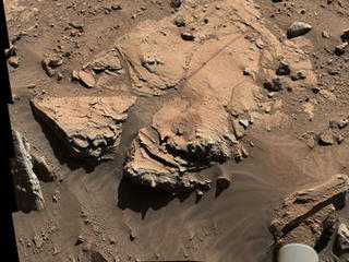 NASA's Curiosity Mars rover has driven within robotic-arm's reach of the sandstone slab at the center of this April 23 view from the rover's Mast Camera.