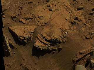 NASA's Curiosity Mars rover has driven within robotic-arm's reach of the sandstone slab at the center of this April 23 view from the rover's Mast Camera.