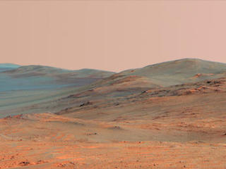 This vista of the Endeavour Crater rim was acquired by NASA's Mars Exploration Rover Opportunity's panoramic camera on April 18, 2014, from "Murray Ridge" on the western rim of the crater. It is presented in false color to make differences in surface materials more easily visible.