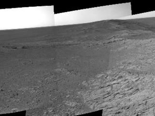 NASA's Mars Exploration Rover Opportunity used its navigation camera on May 10, 2014, to capture this 360-degree view near the ridgeline of Endeavour Crater's western rim. The center is southeastward. Rocks on the slope to the right of center are in an outcrop area targeted for the rover to study.