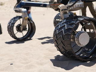 wheel, test, Scarecrow, Mars rover Rover wheels on Scarecrow with chevron-shaped treads rest on sand in Dumont dunes.