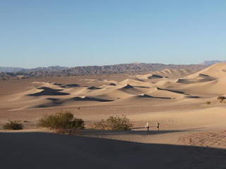 sand dune, mars rover, wheel, Dumont, Scarecrow, test - The image shows a sweeping view of desert sand dunes with two engineers walking in the distance.