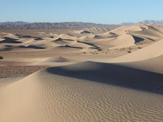 sand dune, mars rover, wheel, Dumont, Scarecrow, test - This image shows a sweeping view of Dumont Dunes in California's Mojave Desert, near Death Valley. One giant dune is pictured in the middle, casting a dark shadow over part of itself.