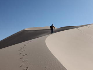 mars rover, desert, dune, test, Scarecrow - Scientist Rob Sullivan hikes up the side of a giant dune, leaving a long trail of footprints in the sand.