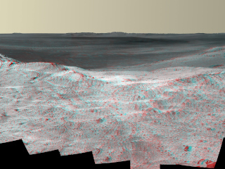 This stereo vista from the panoramic camera (Pancam) of NASA's Mars Exploration Rover Opportunity catches "Pillinger Point," on the western rim of Endeavour Crater, in the foreground.