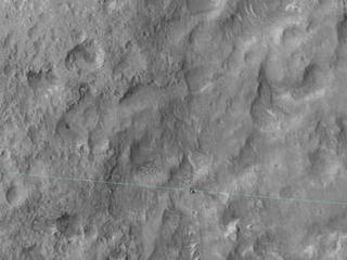 Curiosity-msl-landing-ellipse-edge-HiRise-This image shows Curiosity's landing area, rover tracks and a light blue line crosses showing the rover passing the landing-ellipse boundary.