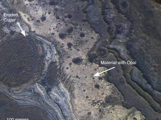 NASA's Mars Reconnaissance Orbiter has revealed Martian rocks containing a hydrated mineral similar to opal. The rocks are light-toned and appear cream-colored in this false-color image taken by the High Resolution Imaging Science Experiment camera. Images acquired by the orbiter reveal that different layers of rock have different properties and chemistry. The opal minerals are located in distinct beds of rock outside of the large Valles Marineris canyon system and are also found in rocks within the canyon. The presence of opal in these relatively young rocks tells scientists that water, possibly as rivers and small ponds, interacted with the surface as recently as two billion years ago, one billion years later than scientists had expected. The discovery of this new category of minerals spread across large regions of Mars suggests that liquid water played an important role in shaping the planet's surface and possibly hosting life.