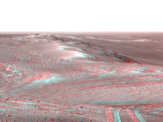 This scene from the panoramic camera (Pancam) on NASA's Mars Exploration Rover Opportunity looks back toward part of the west rim of Endeavour Crater that the rover drove along, heading southward, during the summer of 2014.