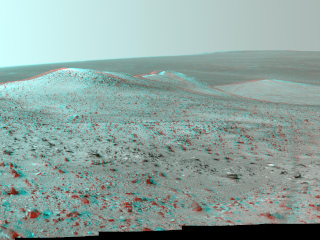 This stereo vista from NASA's Mars Exploration Rover Opportunity shows "Wdowiak Ridge," from left foreground to center, as part of a northward look with the rover's tracks visible at right.