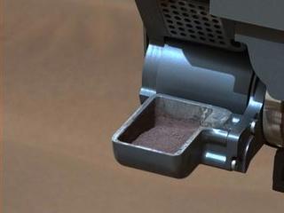 This image from NASA's Curiosity rover shows a sample of powdered rock extracted by the rover's drill from the "Confidence Hills" target -- the first rock drilled after Curiosity reached the base of Mount Sharp in September 2014.