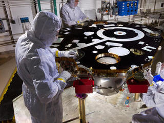 Technicians in a Lockheed Martin clean room near Denver prepare NASA's InSight Mars lander for propulsion proof and leak testing on Oct. 31, 2014.