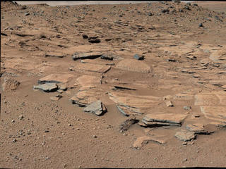 This image from Curiosity's Mastcam shows inclined beds of sandstone interpreted as the deposits of small deltas fed by rivers flowing down from the Gale Crater rim and building out into a lake where Mount Sharp is now.  It was taken March 13, 2014, just north of the "Kimberley" waypoint.