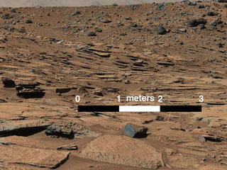 This image from Curiosity's Mastcam shows inclined beds of sandstone interpreted as the deposits of small deltas fed by rivers flowing down from the Gale Crater rim and building out into a lake where Mount Sharp is now.  It was taken March 13, 2014, just north of the "Kimberley" waypoint.