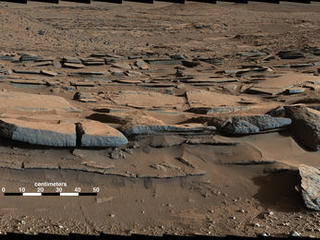 This March 25, 2014, view from the Mastcam on NASA's Curiosity Mars rover looks southward at the Kimberley waypoint. In the foreground, multiple sandstone beds show systematic inclination to the south suggesting progressive build-out of delta sediments in that direction (toward Mount Sharp).