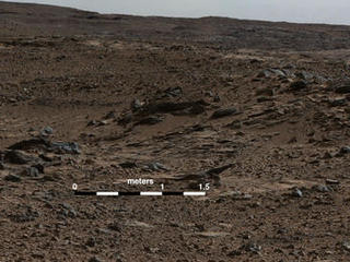 This image shows inclined beds characteristic of delta deposits where a stream entered a lake, but at a higher elevation and farther south than other delta deposits north of Mount Sharp. This suggests multiple episodes of delta growth building southward. It is from Curiosity's Mastcam.