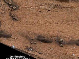 This image shows an example of a thin-laminated, evenly stratified rock type that occurs in the "Pahrump Hills" outcrop at the base of Mount Sharp on Mars. The Mastcam on NASA's Curiosity Mars rover acquired this view on Oct. 28, 2014. This type of rock can form under a lake.