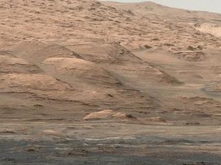This view from the Mastcam on NASA's Curiosity Mars rover shows dramatic buttes and layers on the lower flank of Mount Sharp. It was taken on Sept. 7, 2013, from near the waypoint called "Darwin" on the route toward an entry point to the mountain.
