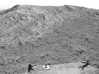 NASA's Mars Exploration Rover Opportunity recorded this view of the summit of "Cape Tribulation," on the western rim of Endeavour Crater on the day before the rover drove to the top. This crest is about 440 feet higher in elevation than the plain surrounding the crater.