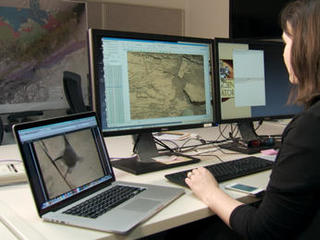 Scientist Katie Stack Morgan examines rover images on her computer. Images, even 3-D stereo views, lack a natural sense of depth that human vision employs to understand spatial relationships.