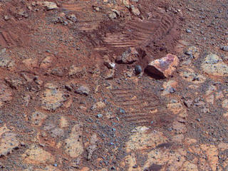 This image from the panoramic camera (Pancam) on NASA's Mars Exploration Rover Opportunity shows where a rock called "Pinnacle Island" had been before it appeared in front of the rover in early January 2014.