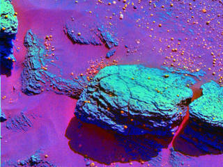 This false-color image taken by the panoramic camera onboard the Mars Exploration Rover Opportunity highlights the spherules that speckle the rock dubbed Stone Mountain