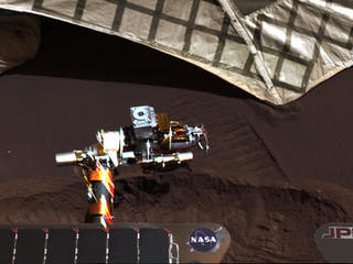 On March 20, 2004, NASA's Mars Exploration Rover Opportunity used a wheel to dig a trench revealing subsurface material beside the lander hardware that carried the rover to the surface of Mars 55 Martian days, or sols, earlier.