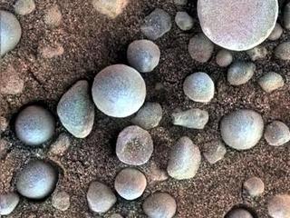 The small spherules on the Martian surface in this close-up image are near Fram Crater, visited by NASA's Mars Exploration Rover Opportunity during April 2004.
