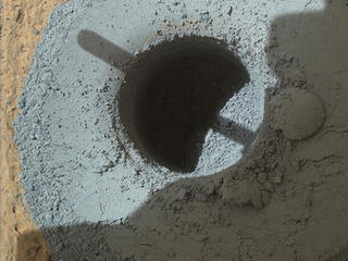 This hole, with a diameter slightly smaller than a U.S. dime, was drilled by NASA's Curiosity Mars rover into a rock target called "Telegraph Peak." The rock is located within the basal layer of Mount Sharp. The hole was drilled on Feb. 24, 2015.