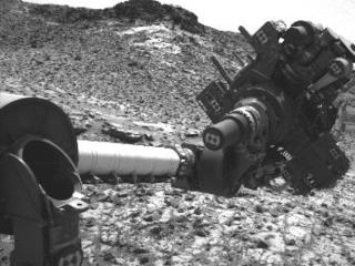This March 4, 2015, image from the Navcam on NASA's Curiosity Mars rover shows the position in which the rover held its arm for several days after a transient short circuit triggered onboard fault-protection programming to halt arm activities on Feb. 27.