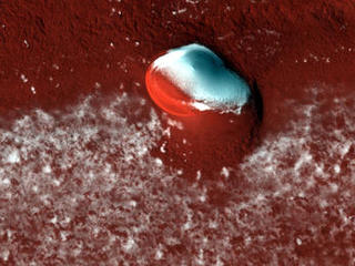 An image of the north polar layered deposits on Mars and the bright ice cap that covers them.