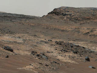 A sweeping panorama combining 33 telephoto images into one Martian vista presents details of several types of terrain visible on Mount Sharp from a location along the route of NASA's Curiosity Mars rover. The component images were taken by the rover's Mast Camera on April 10, 2015.