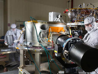 Spacecraft specialists in a clean room at Lockheed Martin Space Systems, Denver, are working on NASA's InSight spacecraft in this January 2015 scene from the mission's assembly and testing phase.