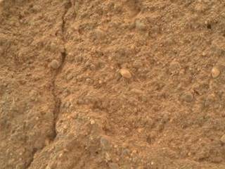 This view of a sandstone target called "Big Arm" covers an area about 1.3 inches (33 millimeters) wide in detail that shows differing shapes and colors of sand grains in the stone.
