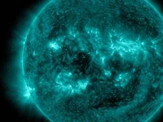 An eruption from the surface of the sun is conspicuous in the lower left portion of this July 6, 2015, image from NASA's Earth-orbiting Solar Dynamics Observatory. It originates from a location on the surface where NASA's Curiosity Mars rover had been tracking a sunspot in late June and early July.