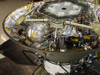 In this photo, NASA's InSight Mars lander is stowed inside the inverted back shell of the spacecraft's protective aeroshell.  It was taken on July 13, 2015, in a clean room of spacecraft assembly and test facilities at Lockheed Martin Space Systems, Denver, during preparation for vibration testing of the spacecraft.