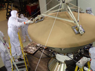 Spacecraft specialists at Lockheed Martin Space Systems, Denver, prepare NASA's InSight spacecraft for vibration testing as part of assuring that it is ready for the rigors of launch from Earth and flight to Mars.