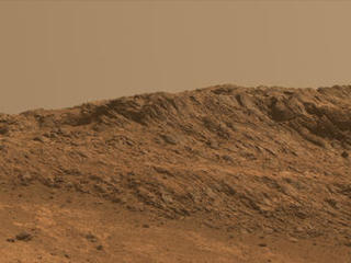 This Martian scene shows contrasting textures and colors of "Hinners Point," at the northern edge of "Marathon Valley," and swirling reddish zones on the valley floor to the left.