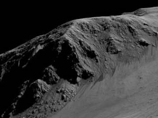 Dark, narrow streaks on Martian slopes such as these at Horowitz Crater are inferred to have been formed by seasonal flow of water on contemporary Mars. Detection of hydrated salts at the streaks supports that interpretation. The features are called "recurring slope lineae."