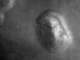HiRISE captured this image of an eroded mesa made famous by its similarity to a human face in a Viking Orbiter image with much lower spatial resolution and a different lighting geometry.