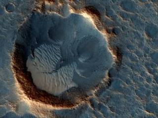 This May 2015 image from the HiRISE camera on NASA's Mars Reconnaissance Orbiter shows a location on Mars associated with the best-selling novel and Hollywood movie, "The Martian." It is in a region called Acidalia Planitia, at the landing site for the science-fiction tale's Ares 3 mission.