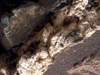 This view from the Mars Hand Lens Imager (MAHLI) on the arm of NASA's Curiosity Mars rover shows a combination of dark and light material within a mineral vein at a site called "Garden City" on lower Mount Sharp. The image was taken on April 4, 2015, and covers an area roughly 1 inch wide.